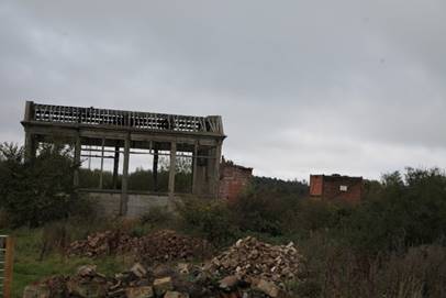 A ruined building with a few rubble
Description automatically generated with medium confidence